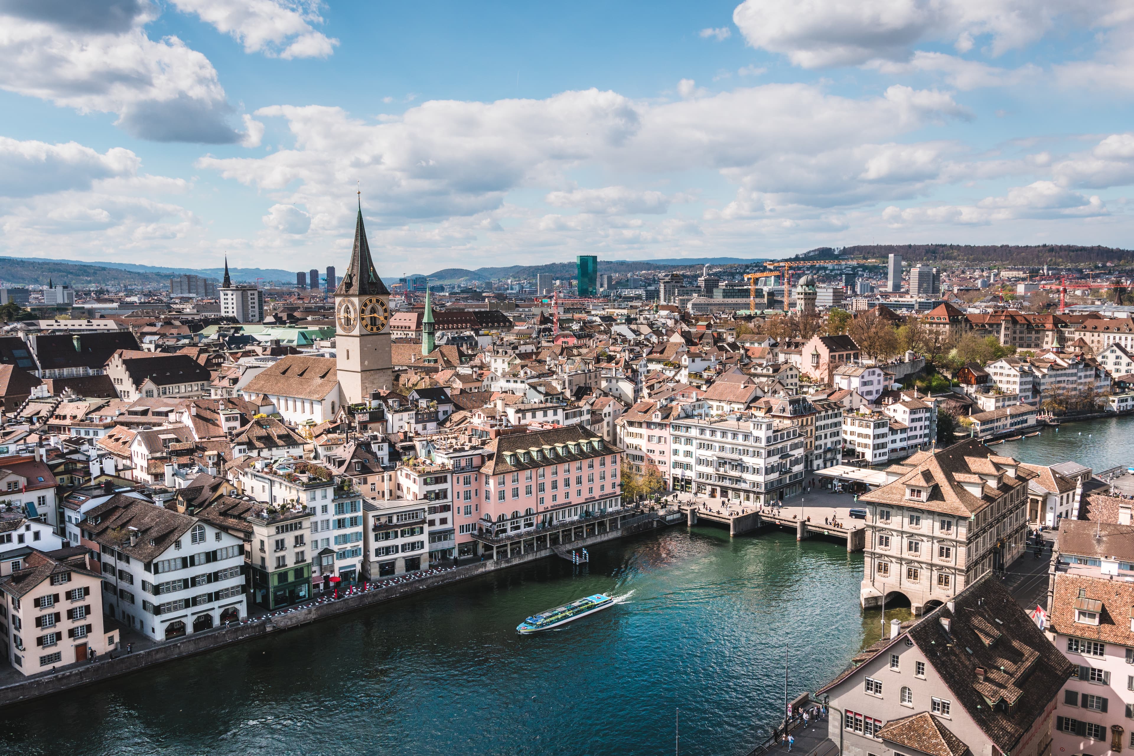 View of downtown Zurich from above on a sunny day, as seen from Grossmünster.