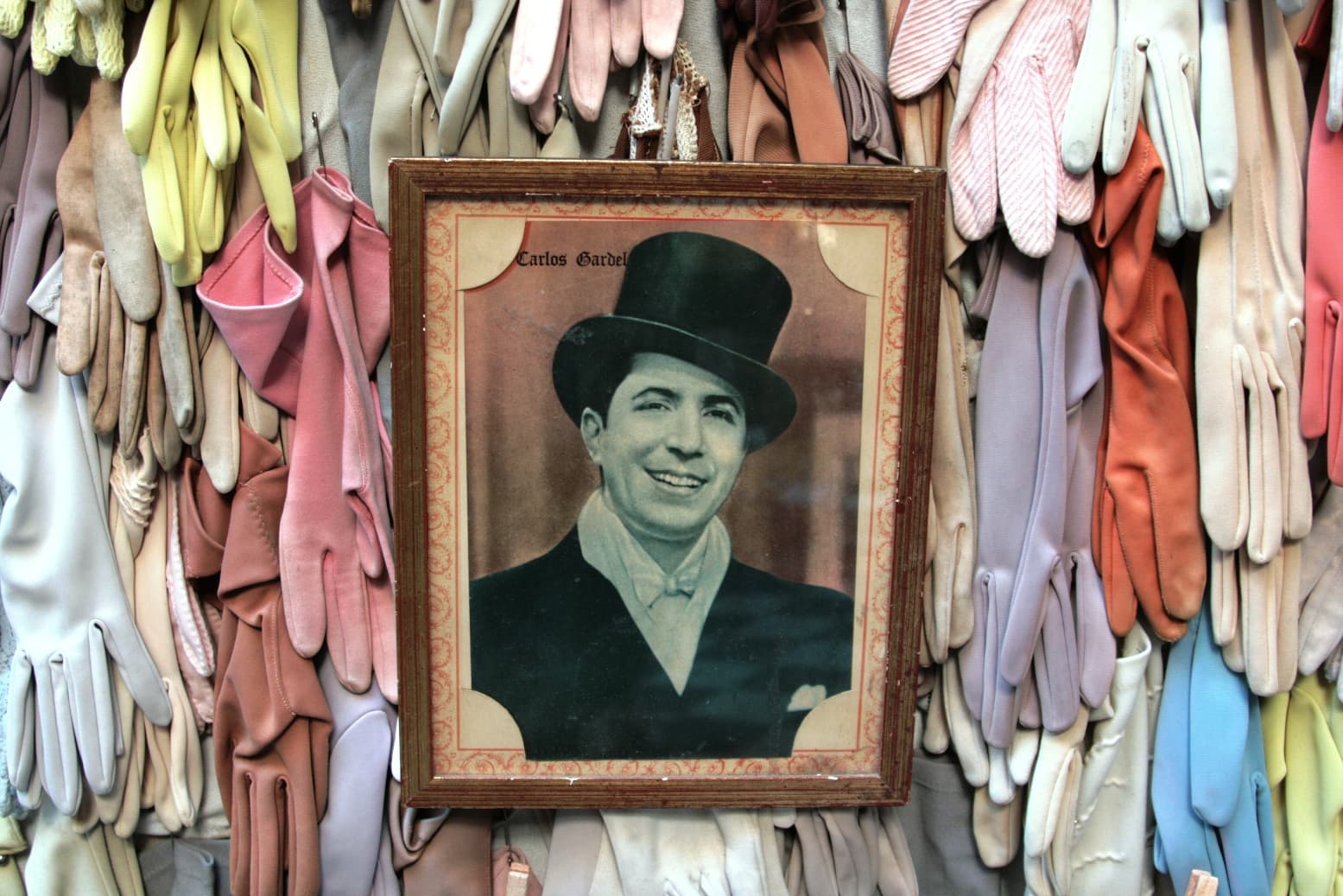Gardel among gloves in San Telmo, Buenos Aires, Argentina