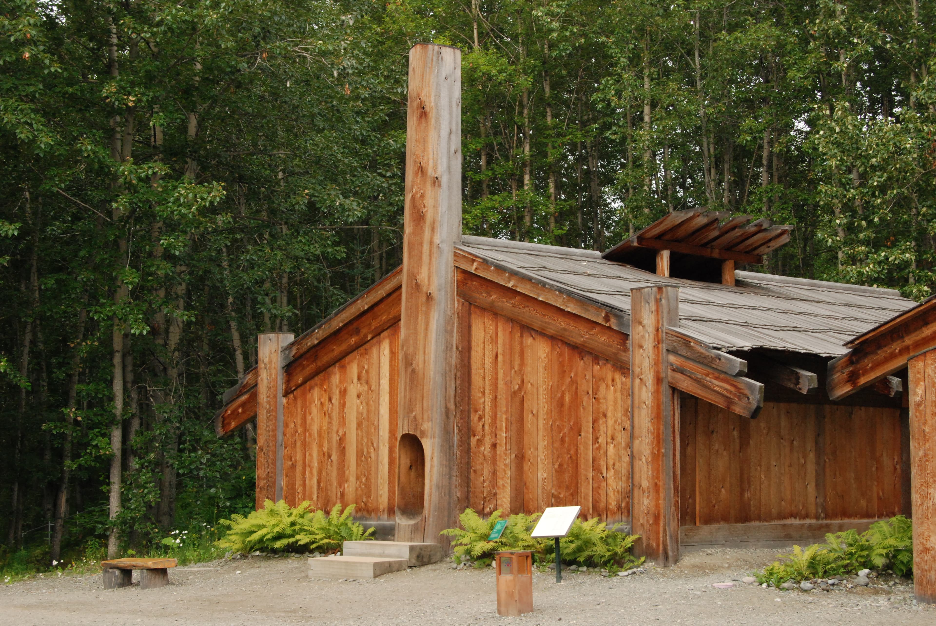 Replica plank house at the Eyak, Tlingit, Haida, and Tsimshian village site, Alaska Native Heritage Center Museum.