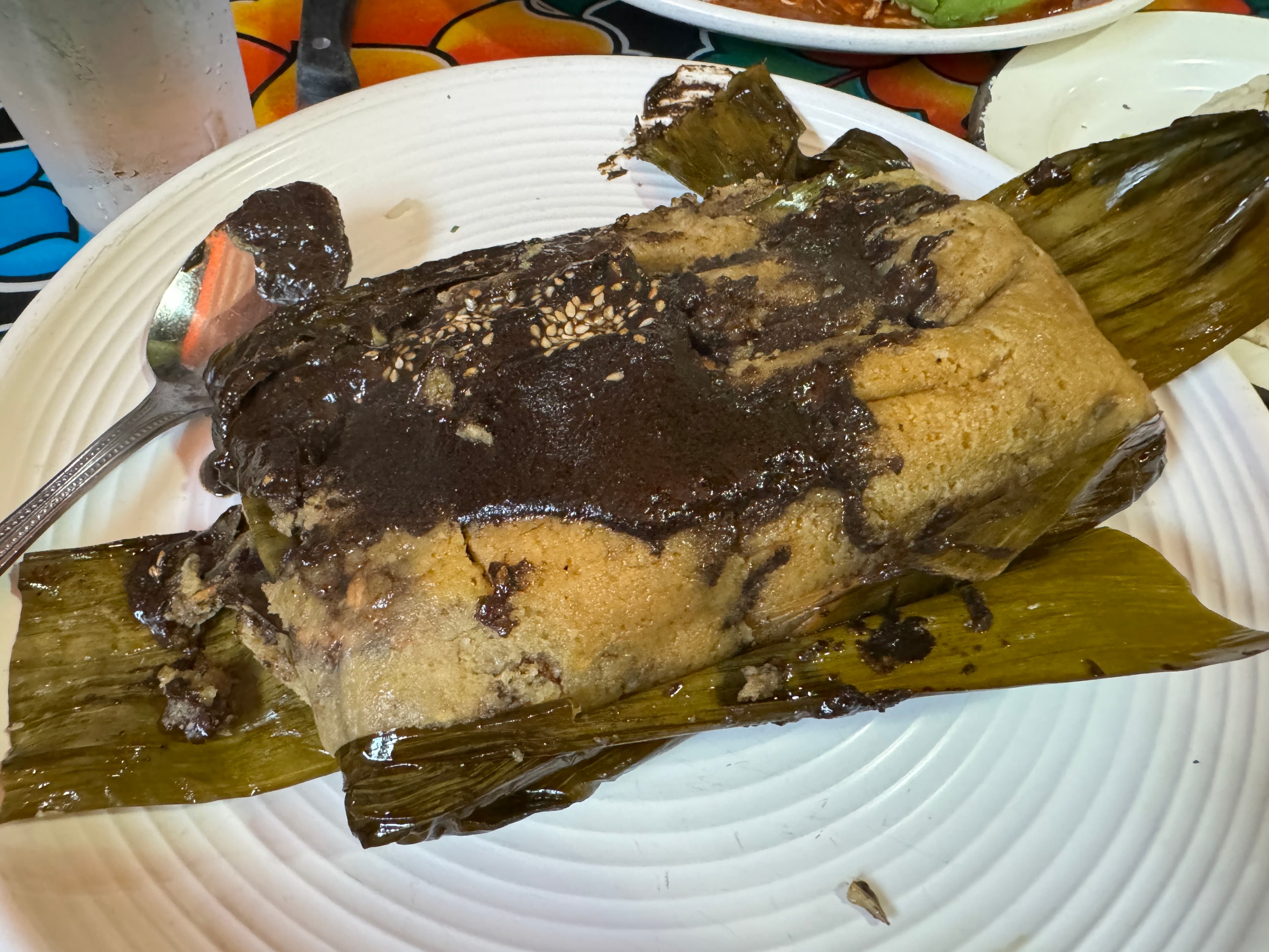 Tamal Oaxaqueño de Mole Negro con Pollo at Guelaguetza Restaurante
