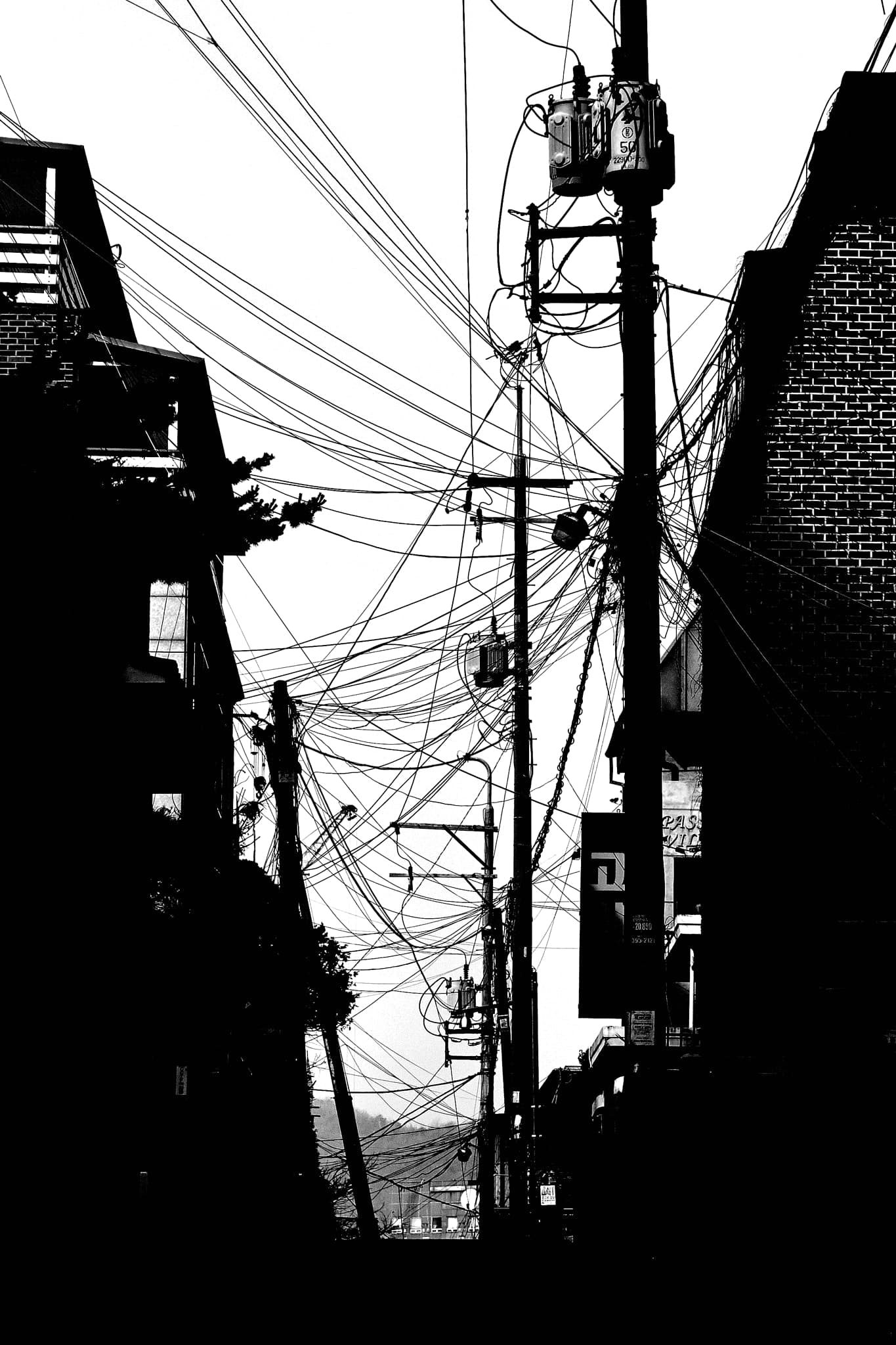 Visit my website for more creative work outside of photography. #sky #street #contrast #building #blackandwhite #pole #lines