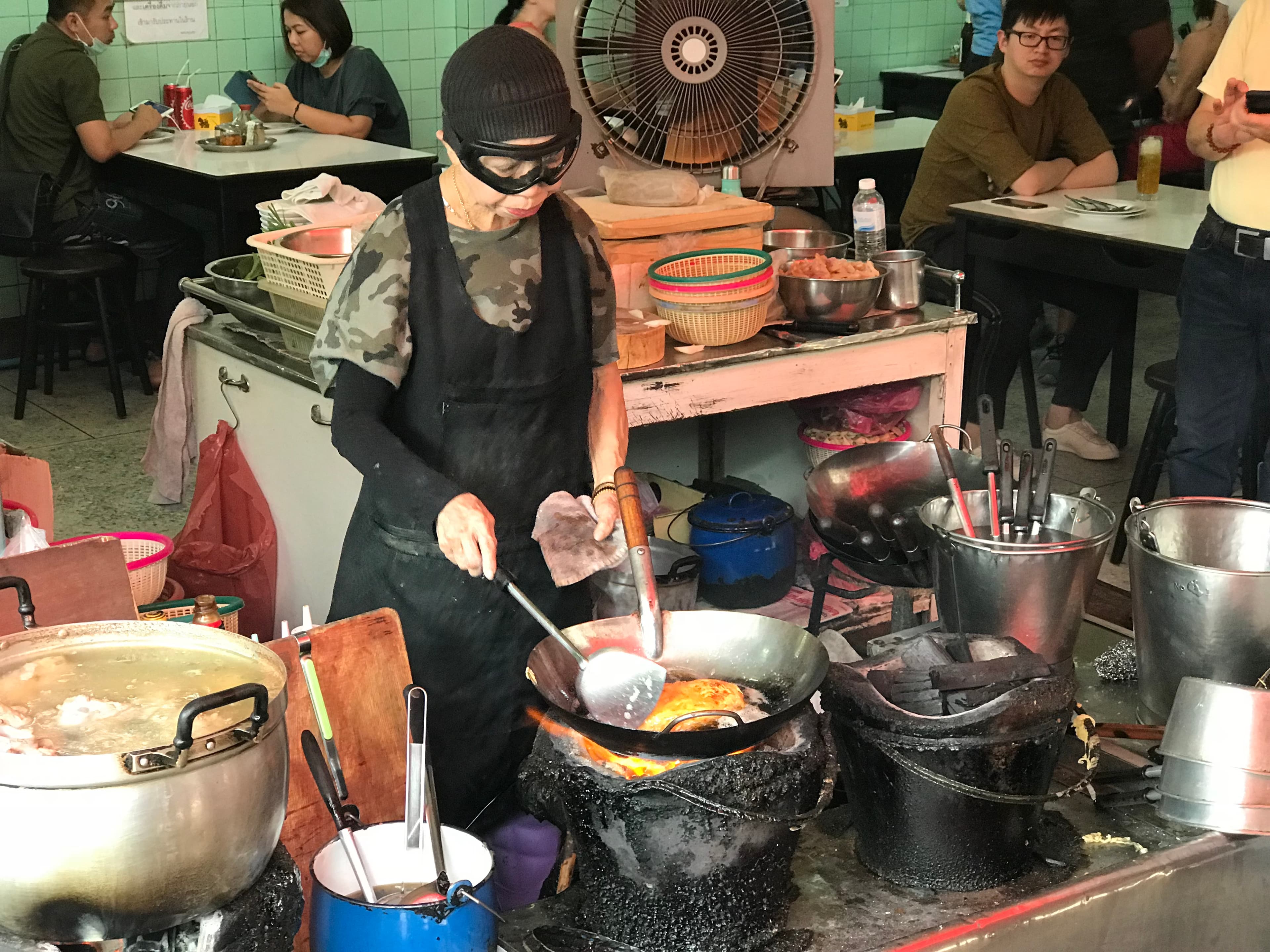 Jay Fai, Bangkok, 2018-04-06: Cooking crab omelette over coal.