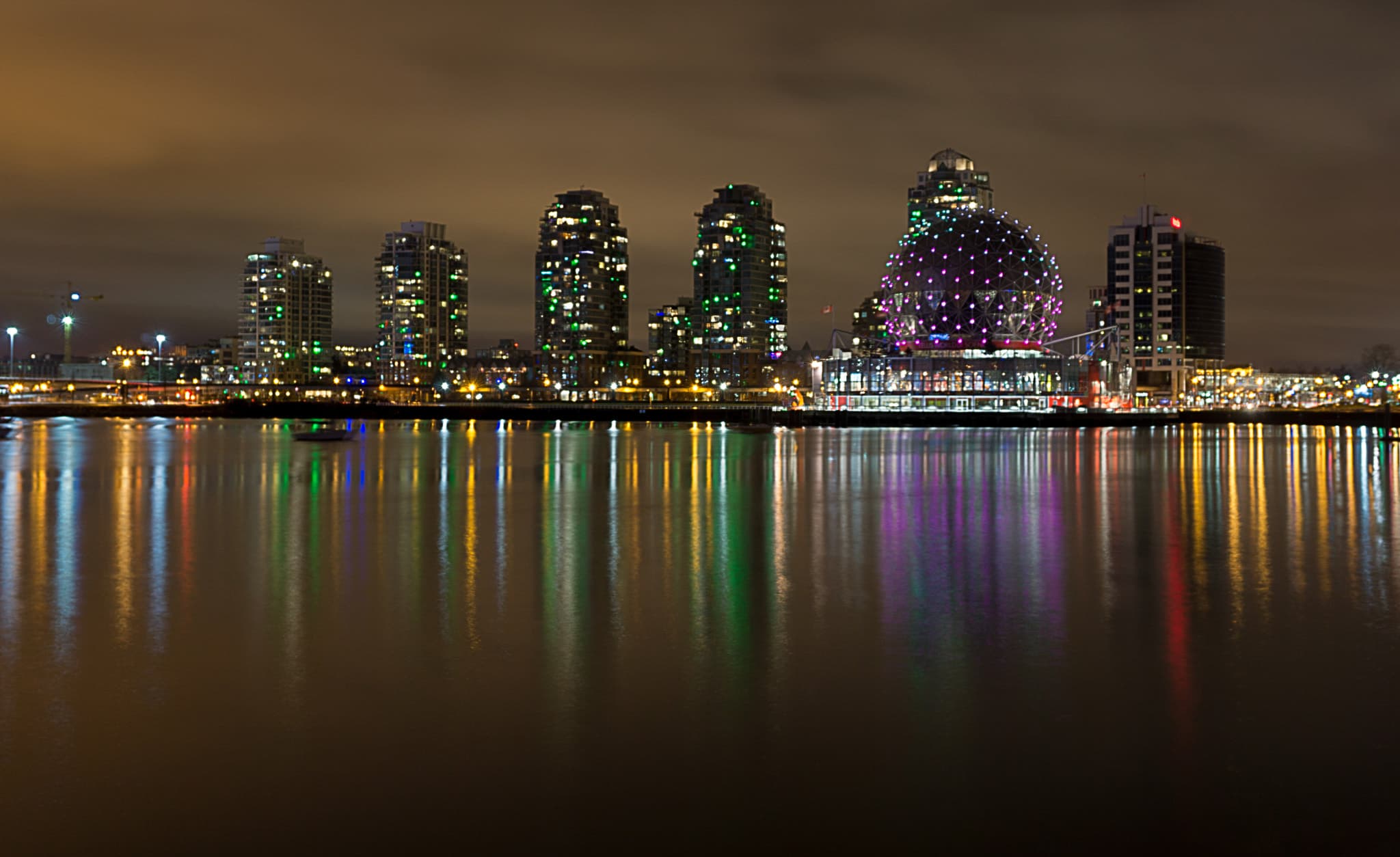 Inside the sphere is the OMNIMAX theatre of Science World. On the outside, it features one of the coolest light shows in downtown Vancouver. On this particular night, a purple blob was chasing a green blob, but with no success. After a few rounds, the purple blob grew larger and engulfed the green blob along with the rest of the sphere.