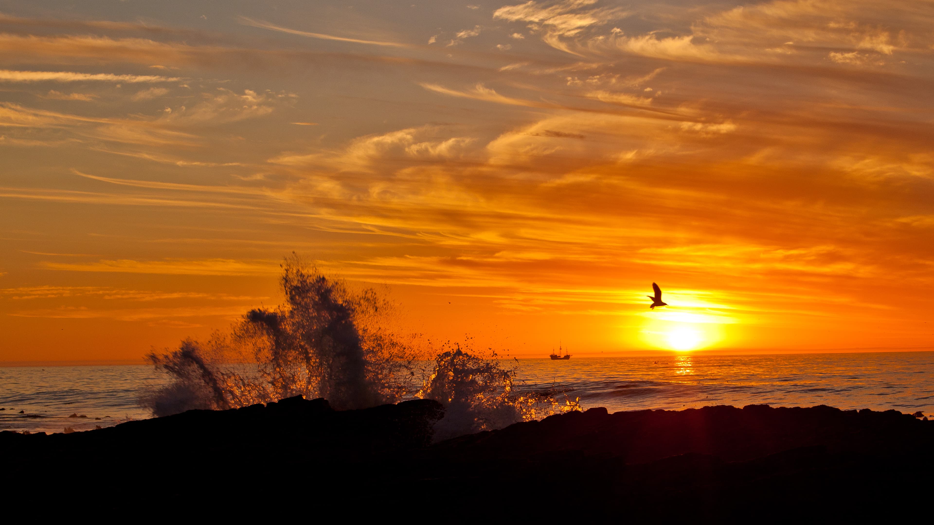 Sunset, Jolly Roger, and the sea