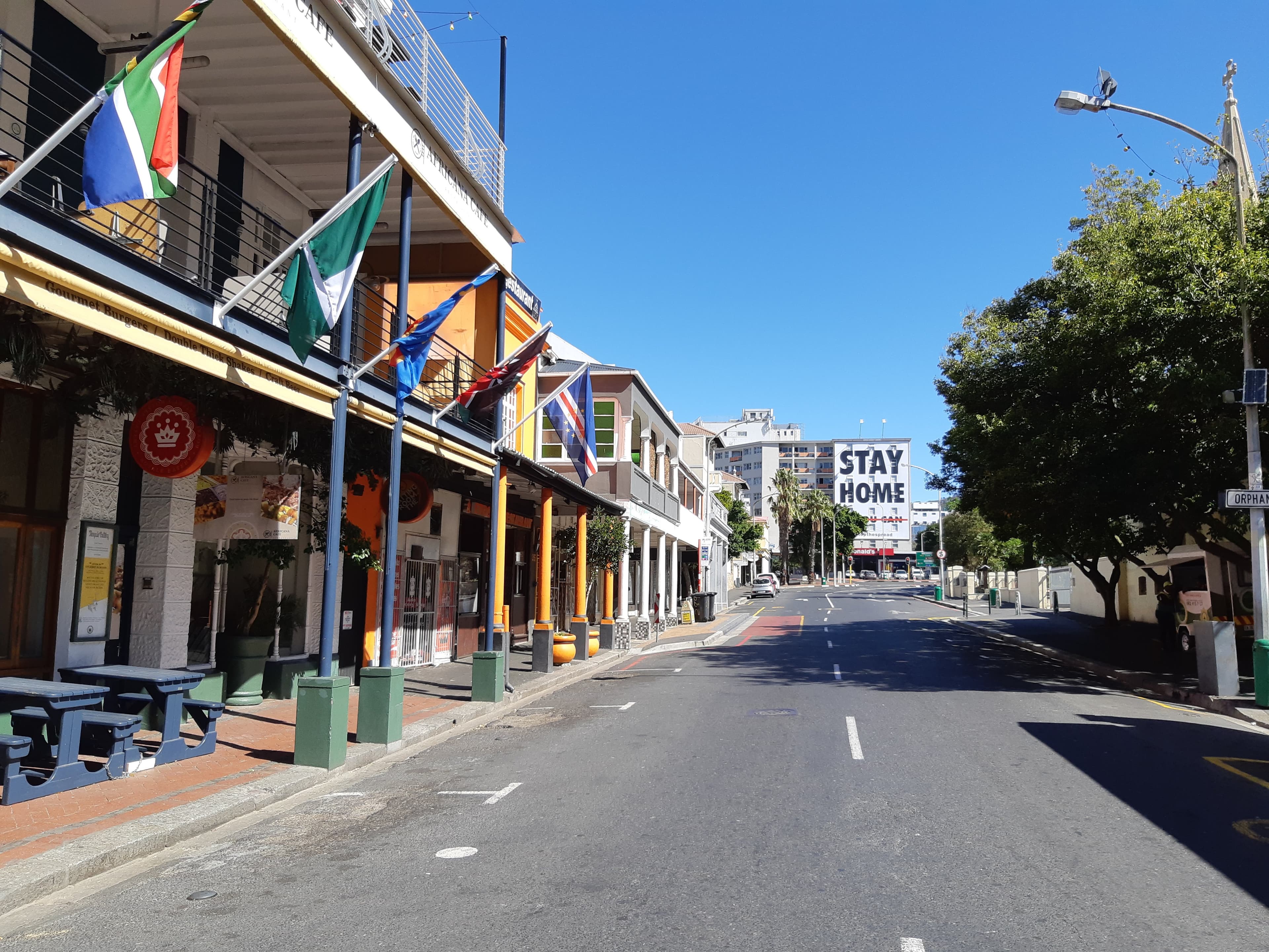 A view down Long Street in Cape Town during the COVID-19 lockdown in April 2020. The billboard on the building at the end of the street urges South Africans to "Stay at Home" during the lockdown period to support the government's efforts to contain the pandemic.