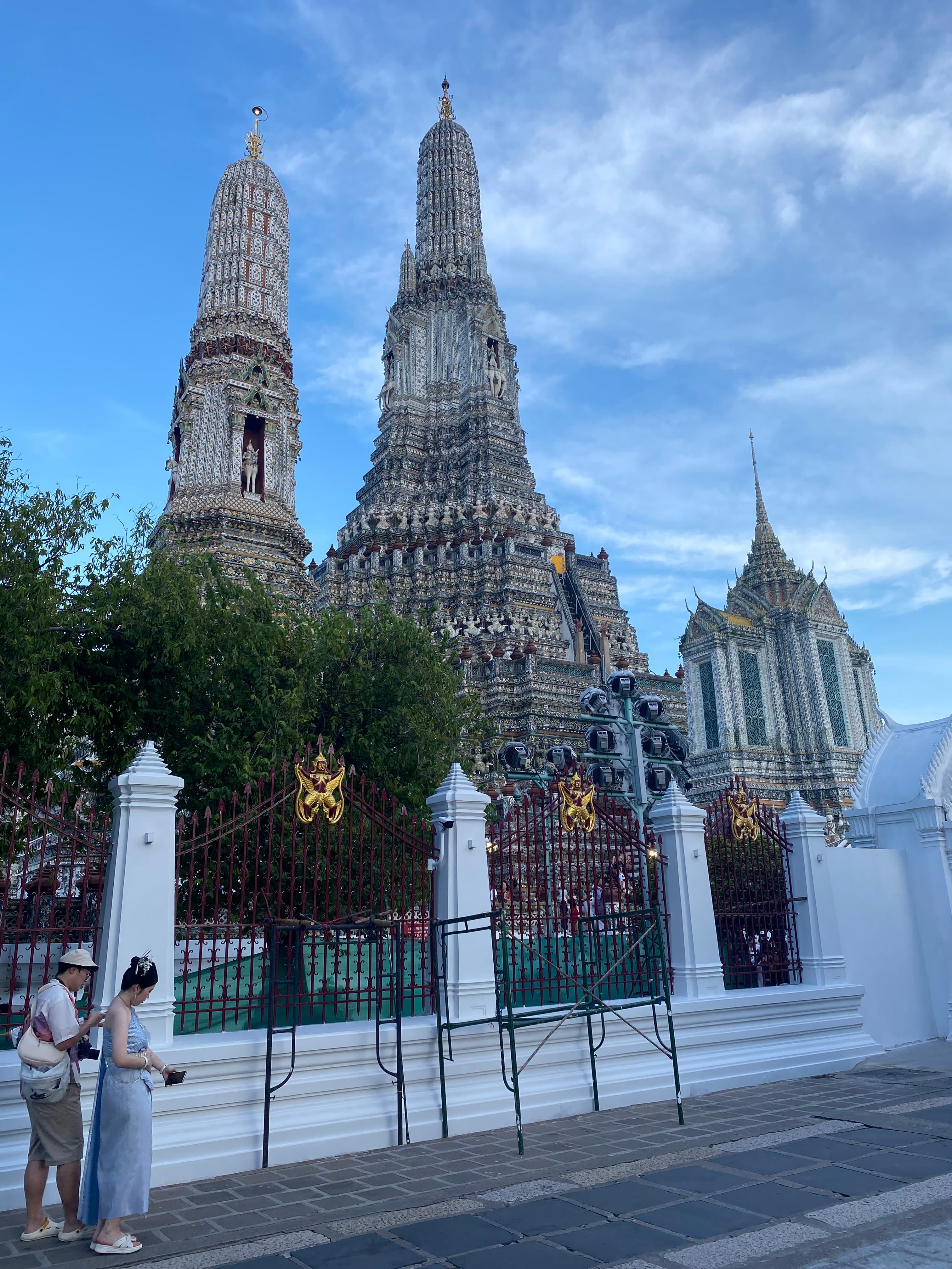 Wat Arun is a stunning temple located in Bangkok, Thailand, known for its iconic spires and breathtaking views of the Chao Phraya River.